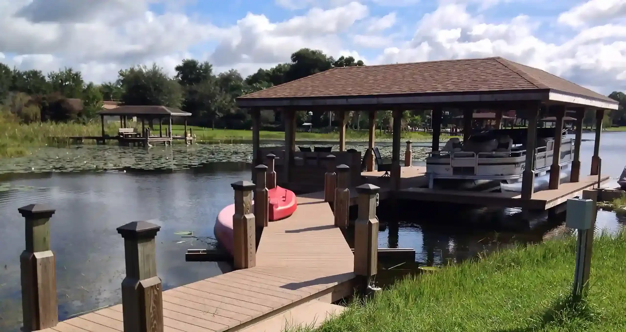 Photo of a dock along a Florida waterfront that looks in good shape because they followed dock maintenance tips from Summertime Deck & Dock
