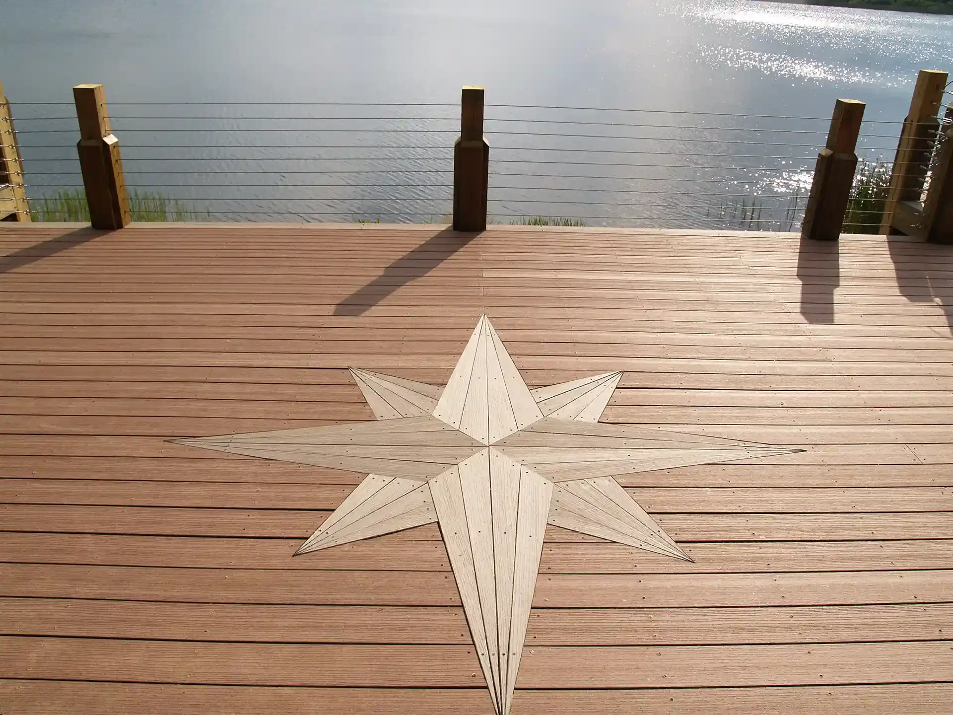 Photo of a custom deck with a compass rose deck tattoo.