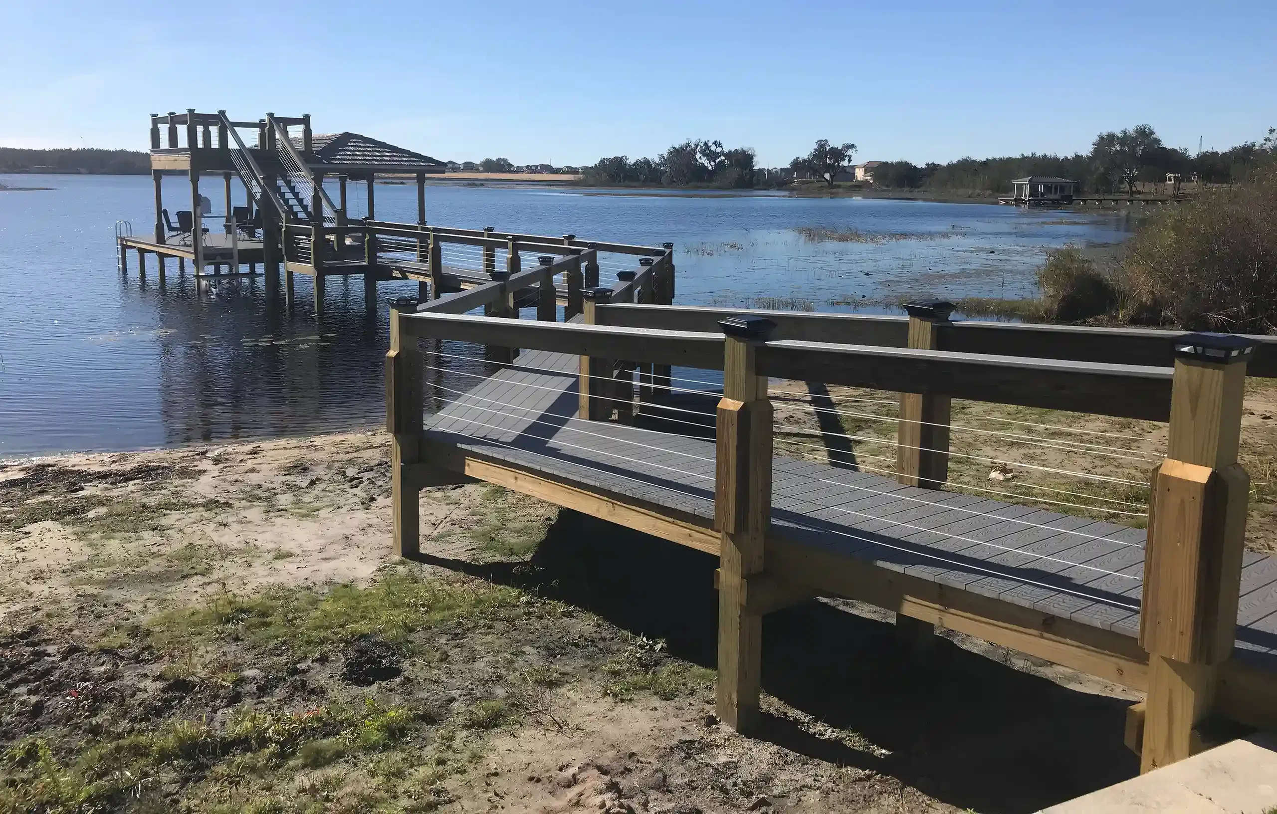 Photo of a double-deck boathouse by Summertime Deck & Dock, two-story dock builders in Orlando and Central Florida.