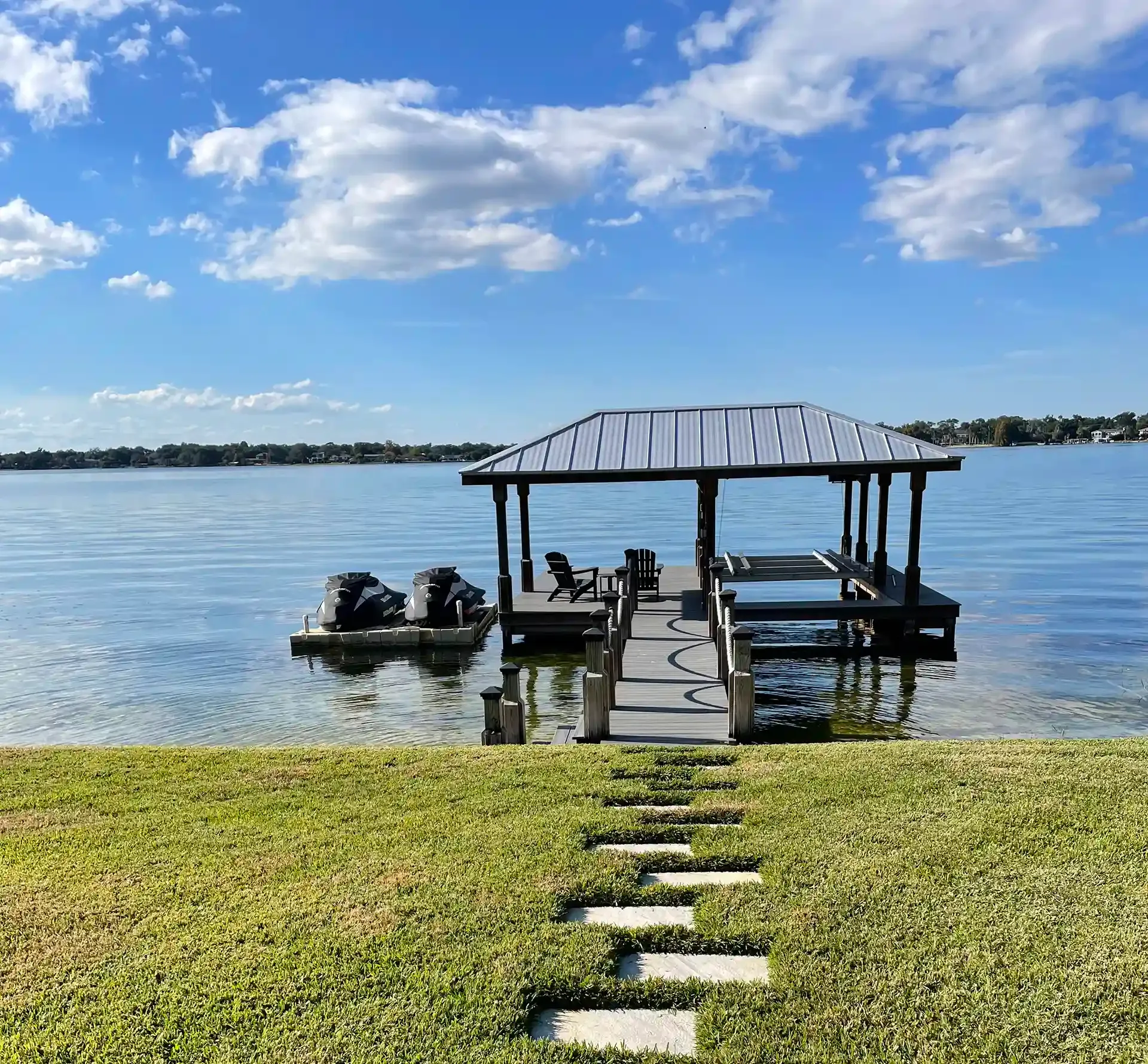 covered boat dock with a personal watercraft dock