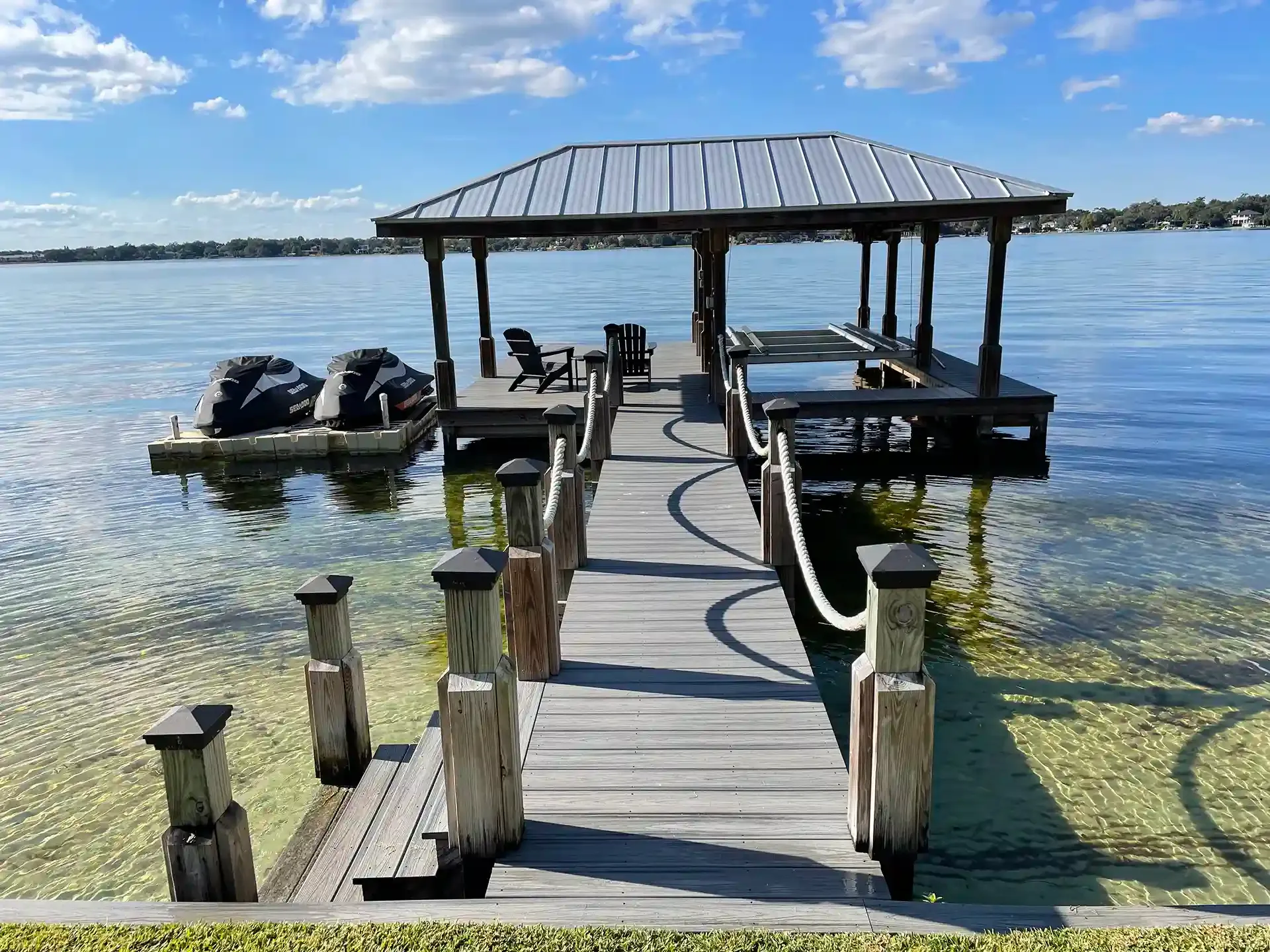 Your Go-To Dock & Deck Builder in Winter Park, FL 2 Boat house with boat lift and floating personal watercraft dock - Custom Boat dock builders in Winter Park florida - boat lift