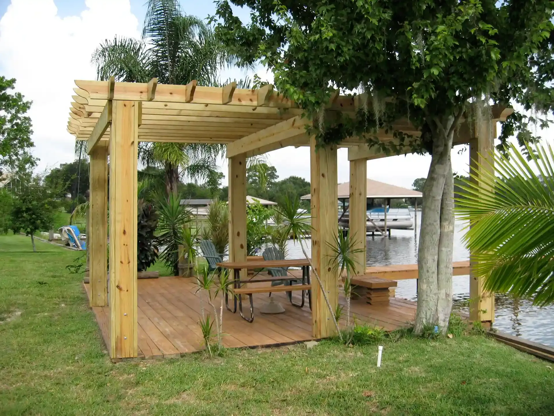 Your Go-To Dock & Deck Builder in Windermere, FL 6 Traditional wooden pergola on a waterfront wooden deck - Pergolas builder and outdoor living structures in Windermere Florida