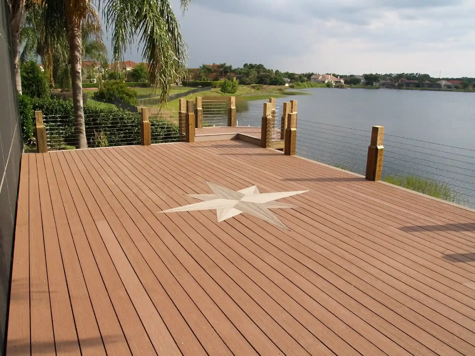 Trex Decking for Decks and Docks 2 photo of a composite deck along with waterfront with a deck inlay - Trex Composite Deck Building Company near me In Central Florida