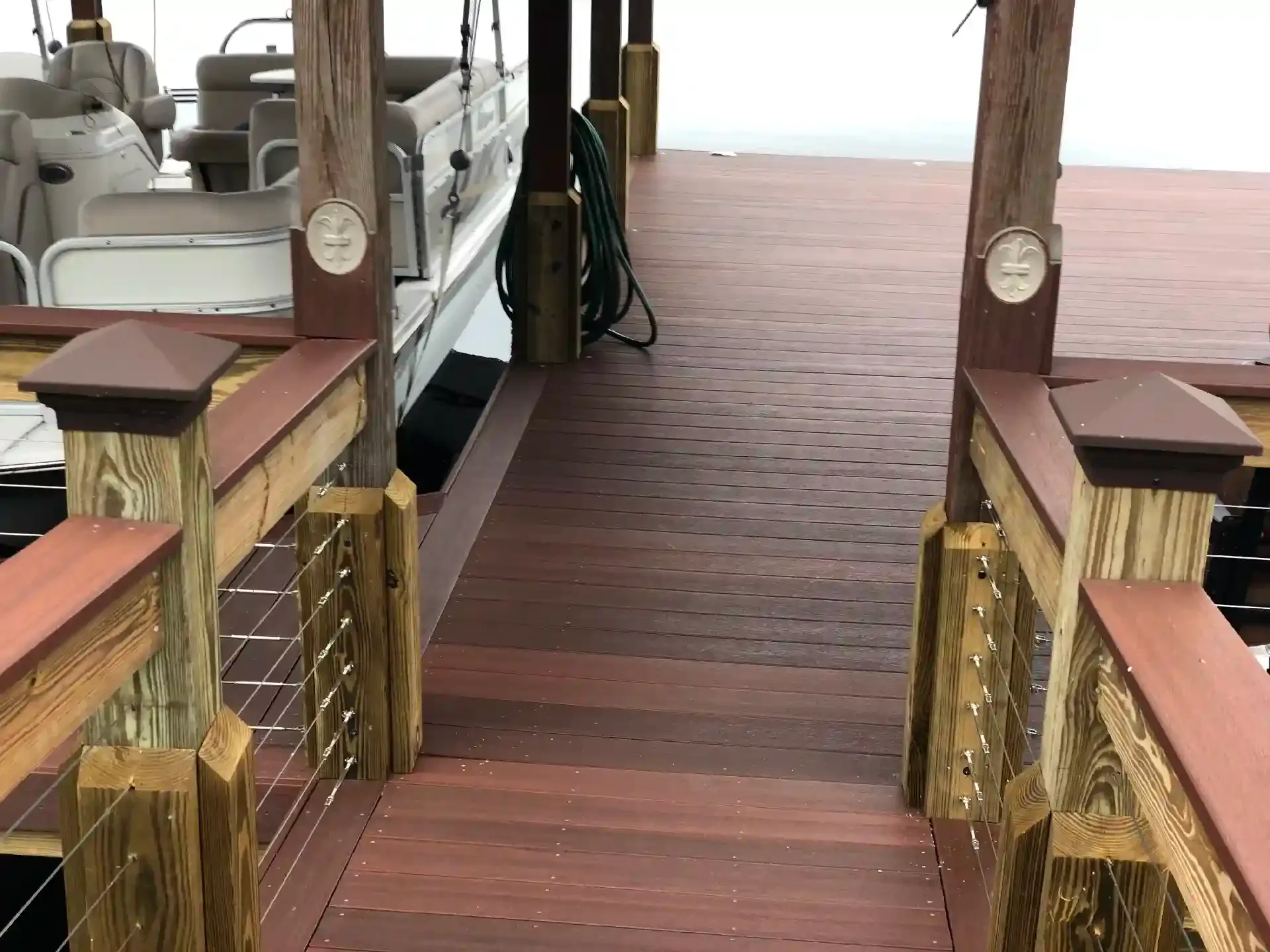 Trex Decking for Decks and Docks 3 photo of a boat dock with composite decking and cable railing - Trex Decking Costs - Composite Dock Builders near me