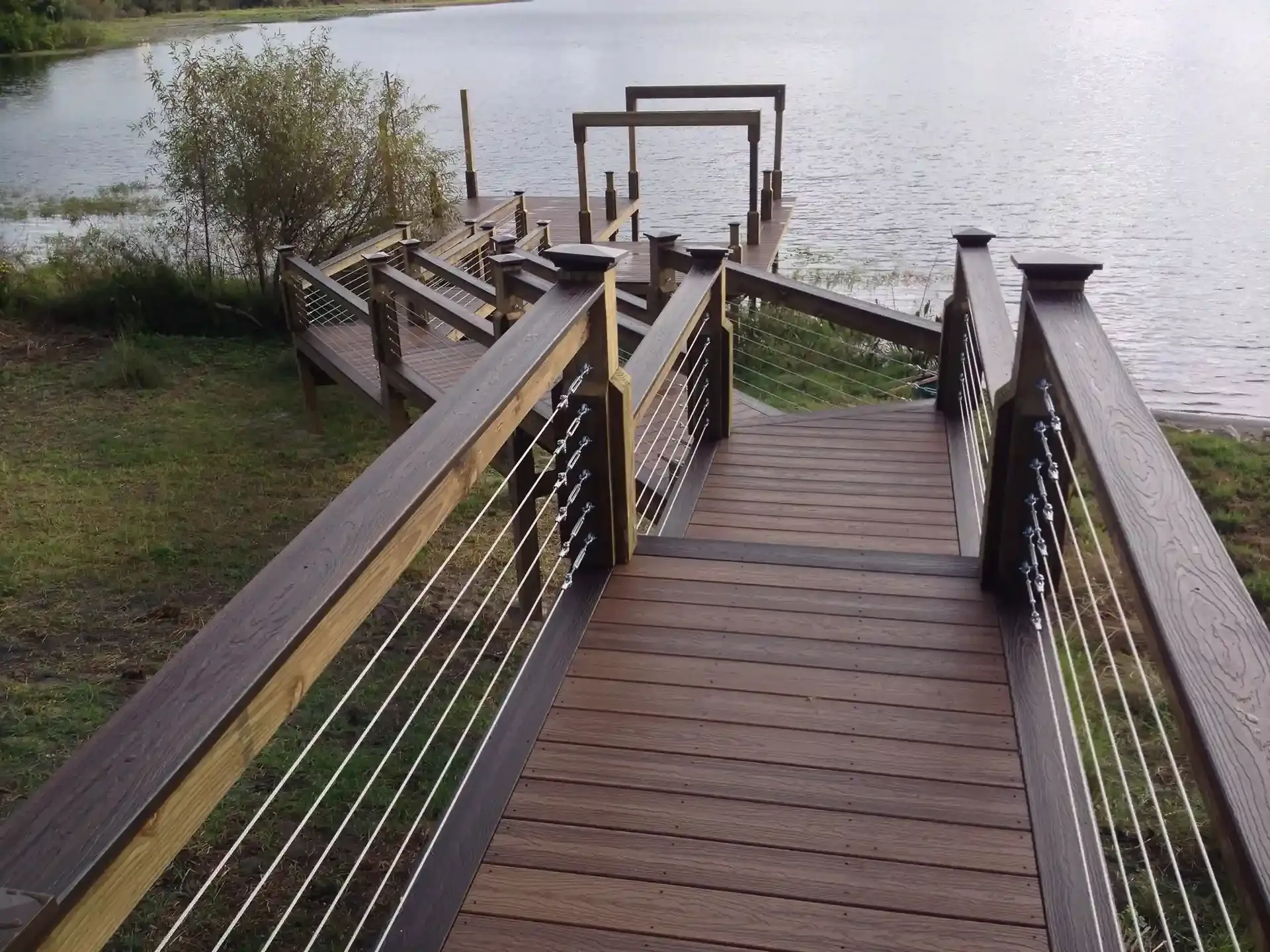 Photo of a walkway from the property to the boat dock with walkway cable railings
