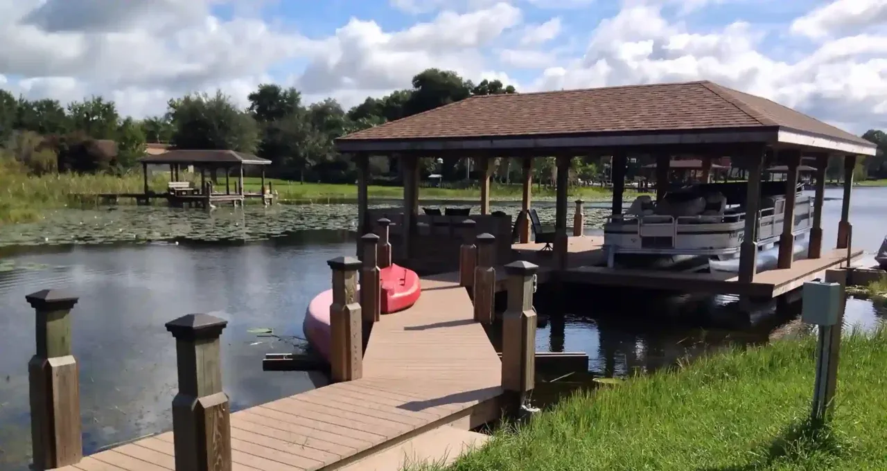 Photo of a dock along a Florida waterfront that looks in good shape because they followed dock maintenance tips from Summertime Deck & Dock