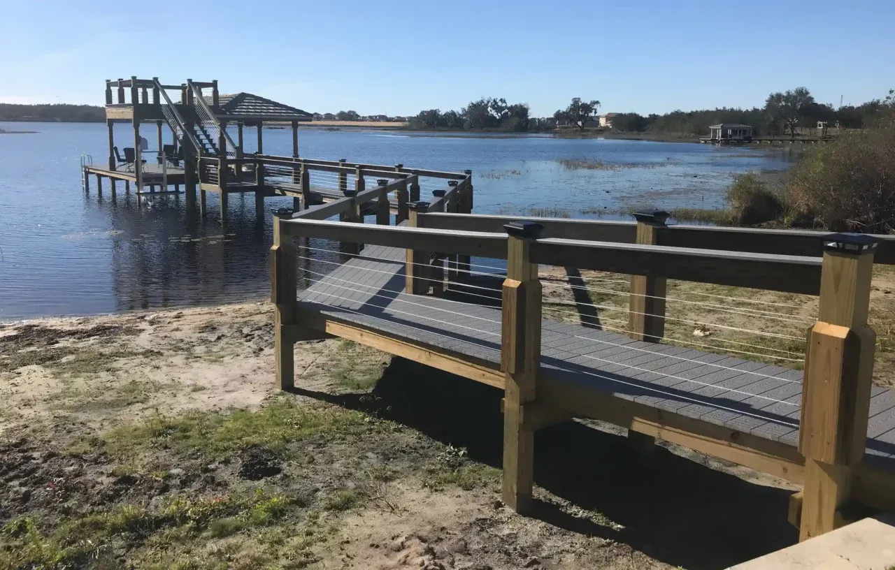 Photo of a double-deck boathouse by Summertime Deck & Dock, two-story dock builders in Orlando and Central Florida.
