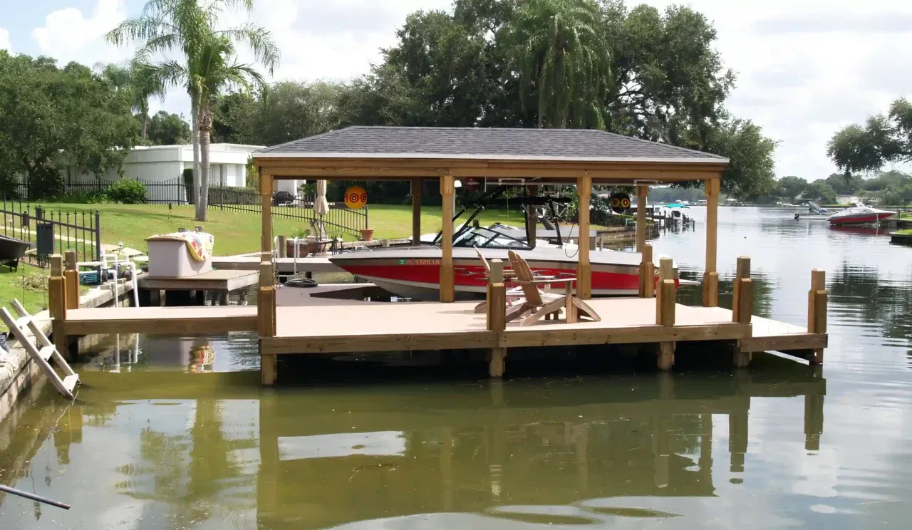 Photo of a boat dock with boat house built by Summertime Deck & Dock, a licensed dock builder in Winter Park, Fla.