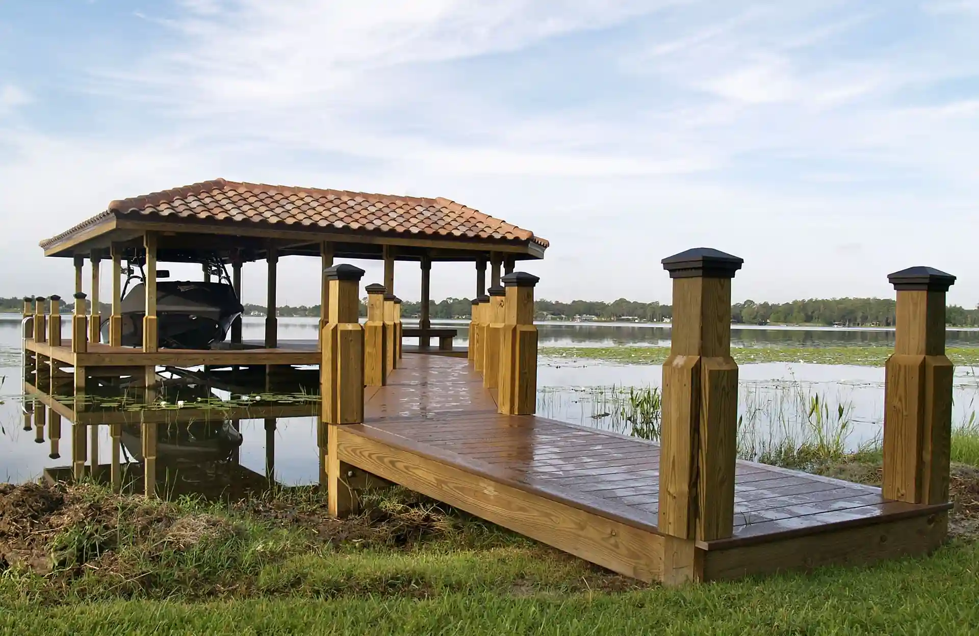 Photo of a custom dock with walkway, zen bench, and boat lift. 
